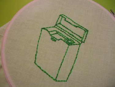 dental floss embroidered in green